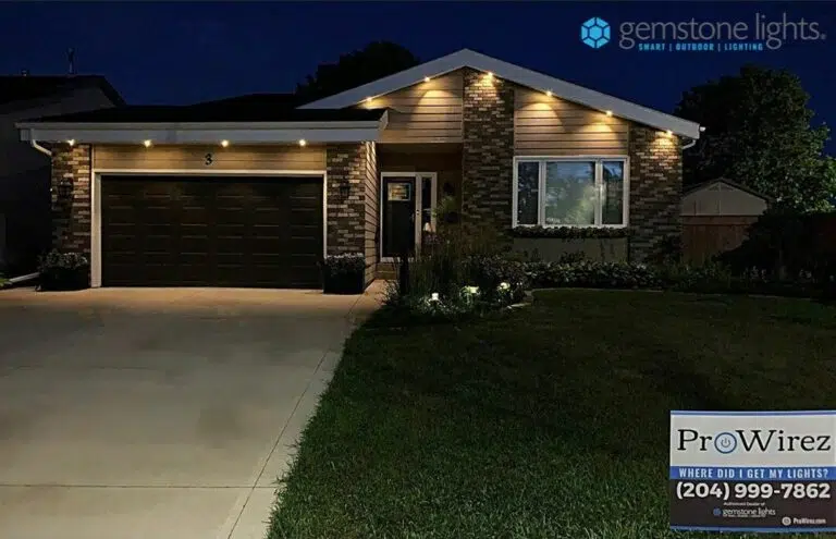 A modern home illuminates softly at night, showcasing stylish exterior lighting
