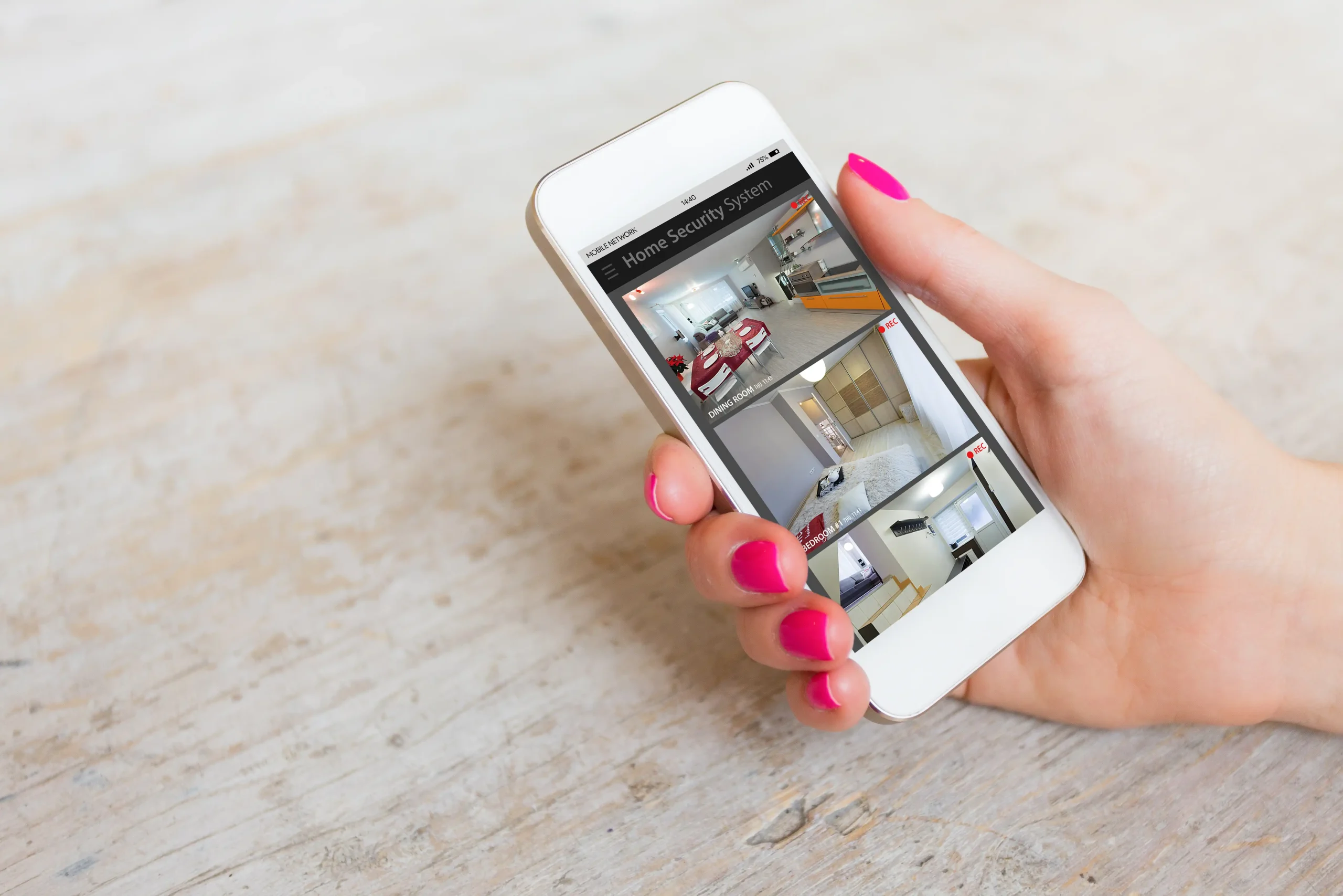 Video security systems in Winnipeg displayed on a smartphone with multiple camera feeds