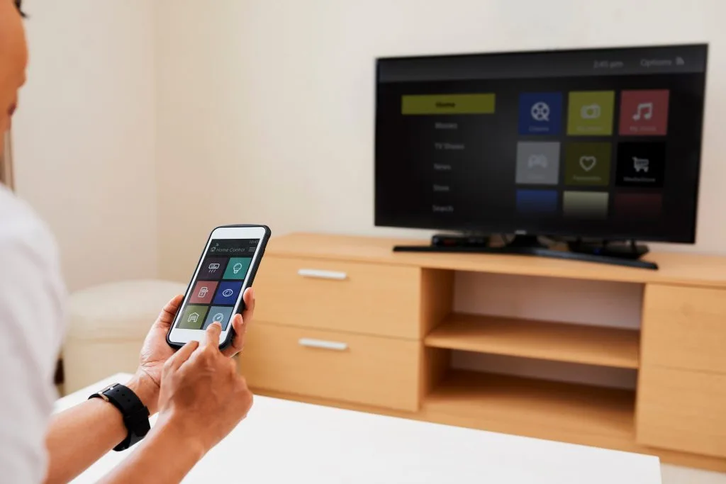 Custom audio visual systems enhance user experience through smartphone interaction with the television interface