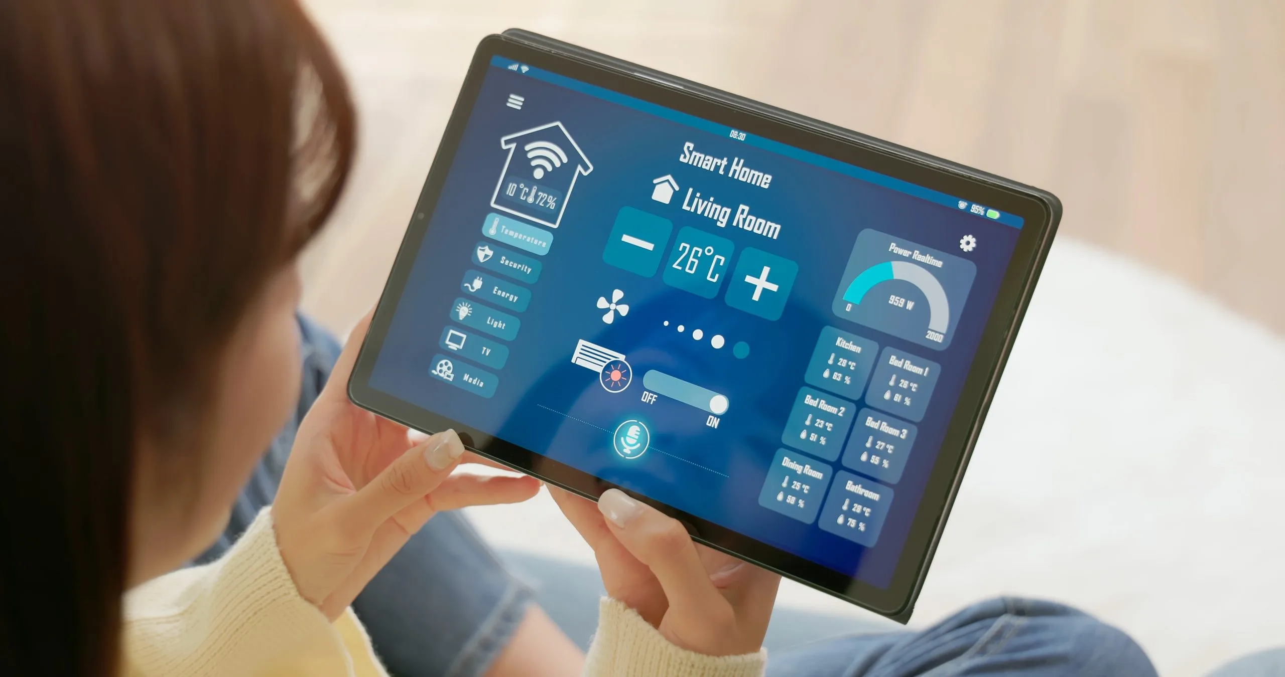Person using a tablet to manage home security systems in Winnipeg